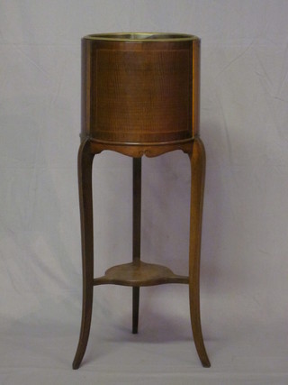 A cylindrical inlaid mahogany jardiniere stand complete with metal liner 12"