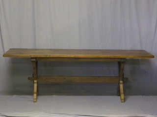 A Continental elm refectory table, raised on X framed supports 88"