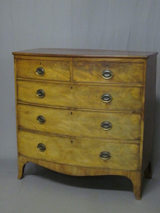 A Georgian bleached mahogany bow front chest of 2 short  and 3 long drawers, raised on splayed bracket feet 41"