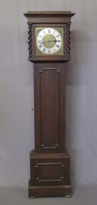 A 1930's 8 day chiming longcase clock with 10" square dial with silvered chapter ring and Roman numerals contained in a  Jacobean style oak case 73"