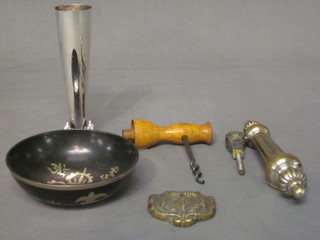 A circular Eastern bowl, a steel and wooden corkscrew, a silver plated vase, a brass door knocker