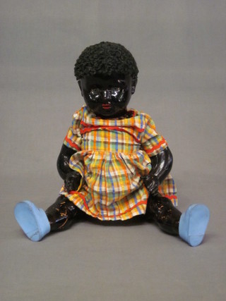 A black doll with articulated limbs 