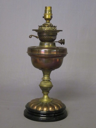 A 19th Century copper oil lamp converted to an electric table  lamp ILLUSTRATED