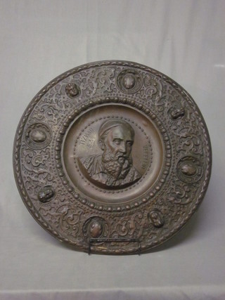 A circular embossed copper charger decorated Vecellio 23"