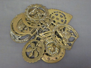 A collection of various reproduction horse brasses