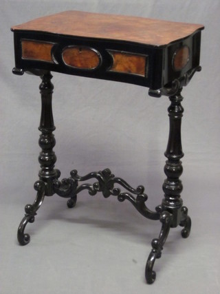 A 19th Century Continental rectangular walnut and ebonised sewing box with hinged lid, raised on turned supports united by  an H framed stretcher 20"