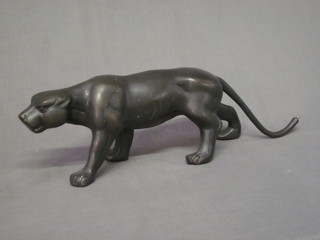 A bronze figure of a walking leopard 18"