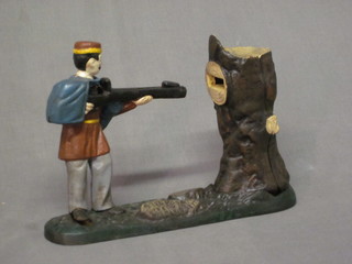 A reproduction novelty iron money box in the form of a  Marksman 9"