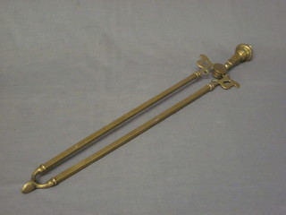 A pair of 19th Century brass fire tongs