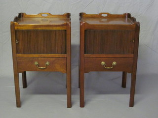 A pair of Georgian style mahogany tray top commodes, each  fitted a cupboard enclosed by tambour shutters, the base fitted  drawers 19"