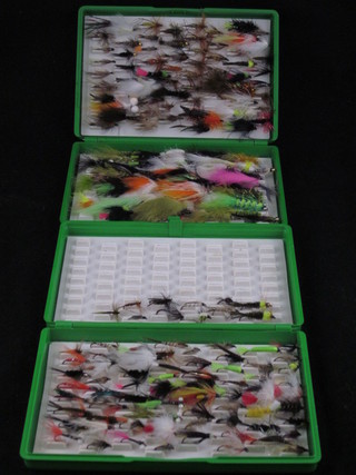 2 plastic boxes of modern flies