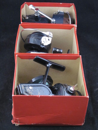 A Mitchell 320 fishing reel and 2 Mitchell 324 fishing reels,  boxed