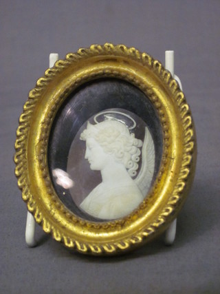 A 19th Century oval shell carved cameo portrait of an Angel, contained in an oval gilt frame 2"