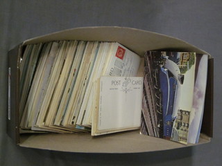 A quantity of various coloured postcards