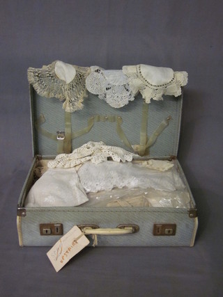An attache case containing a collection of linen