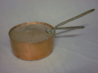 A large circular 19th Century copper saucepan with iron handled  and lid