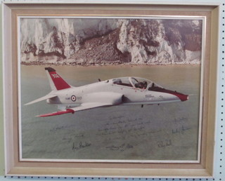 A colour photograph of a British Aerospace Hawk aircraft signed  by various test pilots 15" x 19"