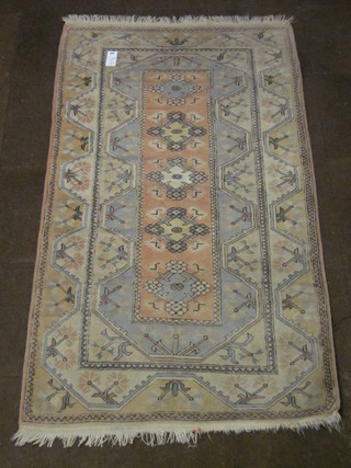 A Caucasian style rug with rectangular medallion to the centre and having geometric designs 82" x 47"