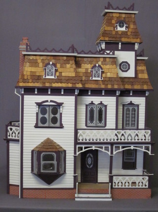 A large and impressive American wooden dolls house 31"