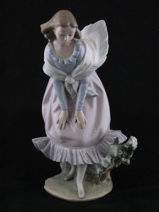 A Lladro figure of a standing girl, the base impressed G-25J 12" ILLUSTRATED