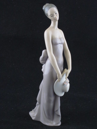A Lladro figure of a standing lady 8"