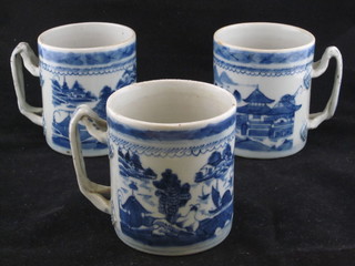 3 19th Century blue and white porcelain tankards with strapwork  handles 4"