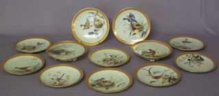 A handsome 12 piece Minton dessert service comprising 2  comports 9" and 10 dessert plates, all with duck egg blue  backgrounds, decorated birds and birds nests within gilt banding,  some with light contact marks, the bases marked G1215W and  impressed Minton, 1 with firing crack to base