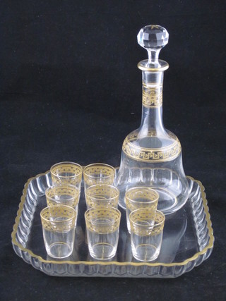 A Continental glass liqueur set comprising square tray, club shaped decanter and stopper and 8 small glasses, 1 cracked,