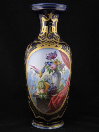 A blue ground Continental porcelain club shaped vase decorated  fruit and a bird 16", chip to base,