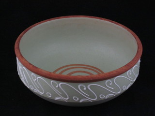 A circular green glazed Denby pottery bowl 8"