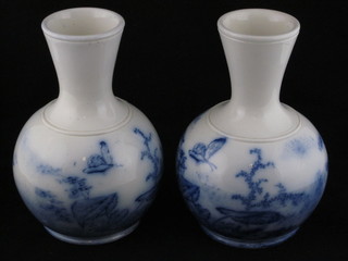 A pair of Edwardian club shaped pottery vases decorated  butterflies 8"