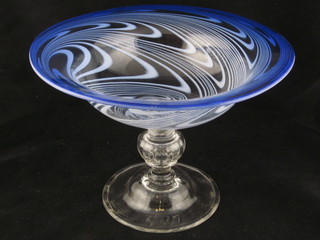 A  Gray-Stan purple glass bowl, raised on a circular spreading  foot 12"