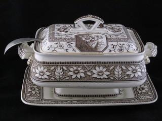 A Victorian Palmyra brown glazed tureen and cover and a silver plated ladle, raised on a stand 11"