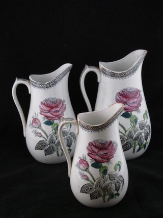 3 19th Century graduated jugs with floral decoration