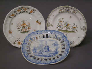 An oval blue and white pierced platter decorated a Romantic Scene 10" and 2 Quimperware plates