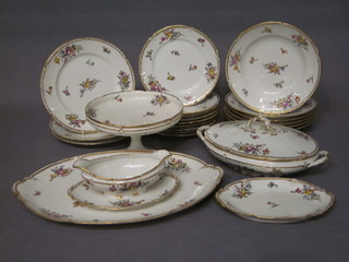 A 23 piece French GDA pattern dinner service comprising 17"  oval dish, twin handled tureen and cover 11", sauce boat, 9"  comport, boat shaped dish 9", 6 9" soup bowls, 3 9 1/2" dinner  plates and 9 8" side plates