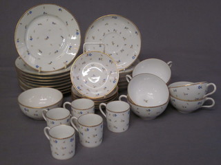 A 30 piece Continental tea service comprising 9 plates 7" - 1  cracked, 6 saucers, 6 cups - 2 cracked, 6 coffee saucers - 1  cracked, 5 coffee cans and a sugar bowl