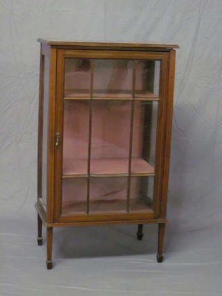 An Edwardian mahogany display cabinet the interior fitted  shelves enclosed by astragal glazed panelled door, raised on  square tapering supports 24"