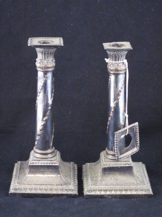 A pair of 19th Century silver plated candlesticks with Corinthian  style capitals, raised on square feet 9", 1 sconce f,