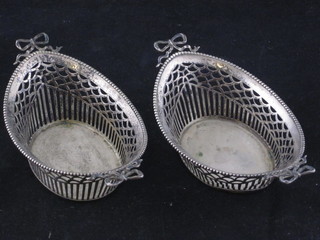 A pair of French pierced white metal oval bon bon dishes