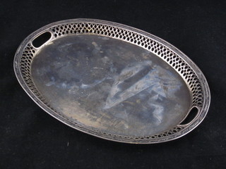 A Continental oval pierced white metal twin handled tray 11"