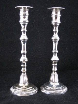 A pair of silver plated candlesticks 12"