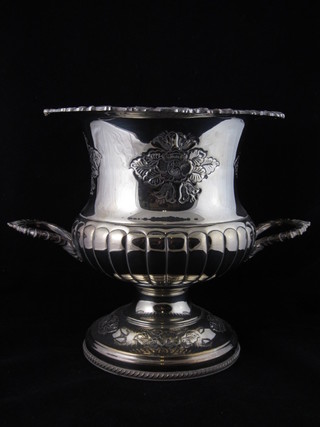 An embossed silver plated twin handled wine cooler