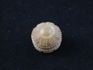 A circular carved ivory trinket box 1"
