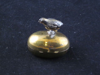 A gilt metal trinket box in the form of an egg with chick finial 1"
