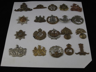 20 various cap badges including The Durham Light Infantry, Grenadier Guards, Royal Fusiliers, Gloucester Regt. etc