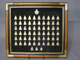 A set of 63 gilt metal and enamel RAF Squadron badges,  contained in a frame