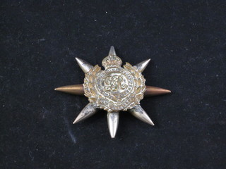 A Trench Art paperweight formed from bullets and a Royal  Engineers cap badge