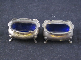 A pair of Edwardian silver salts, Birmingham 1901, complete  with blue glass liners, 3 ozs