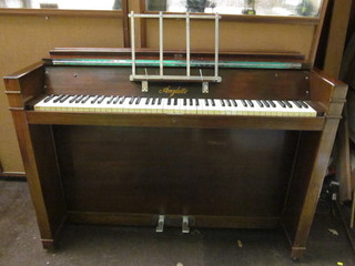 An Art Deco iron framed cottage piano contained in a walnut  case by A M Wylett